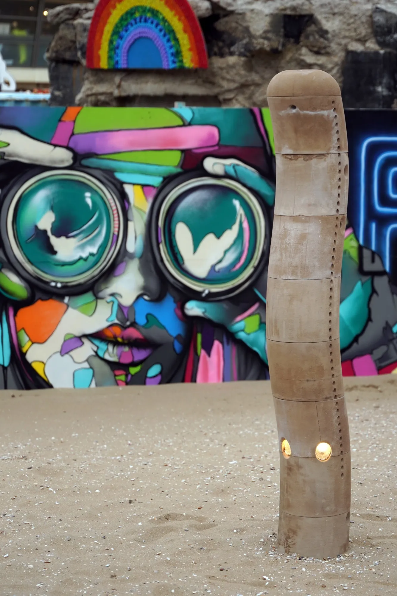 Close detail of the sculpture’s stacked segments and embedded lights